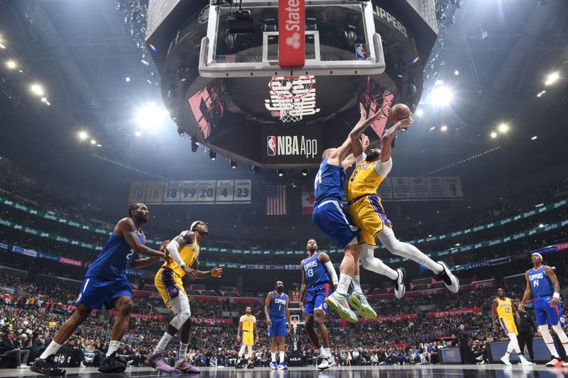 LOS ANGELES, CA - JANUARY 23:  Anthony Davis #3 of the Los Angeles Lakers goes to the basket during the game on January 23, 2024 at Crypto.Com Arena in Los Angeles, California. NOTE TO USER: User expressly acknowledges and agrees that, by downloading and/or using this Photograph, user is consenting to the terms and conditions of the Getty Images License Agreement. Mandatory Copyright Notice: Copyright 2024 NBAE (Photo by Adam Pantozzi/NBAE via Getty Images)