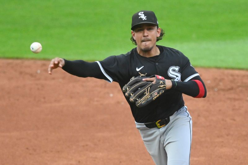 Jul 3, 2024; Cleveland, Ohio, USA; Chicago White Sox shortstop Nicky Lopez (8) throws to first base in the third inning against the Cleveland Guardians at Progressive Field. Mandatory Credit: David Richard-USA TODAY Sports