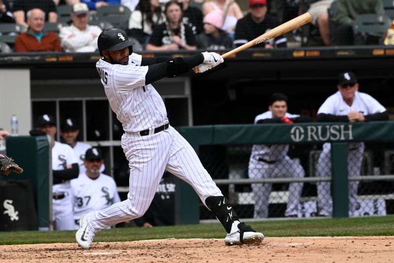 Apr 5, 2023; Chicago, Illinois, USA;  Chicago White Sox second baseman Elvis Andrus (1) hits his 2000th career hit during the fifth inning against the San Francisco Giants  at Guaranteed Rate Field. Mandatory Credit: Matt Marton-USA TODAY Sports