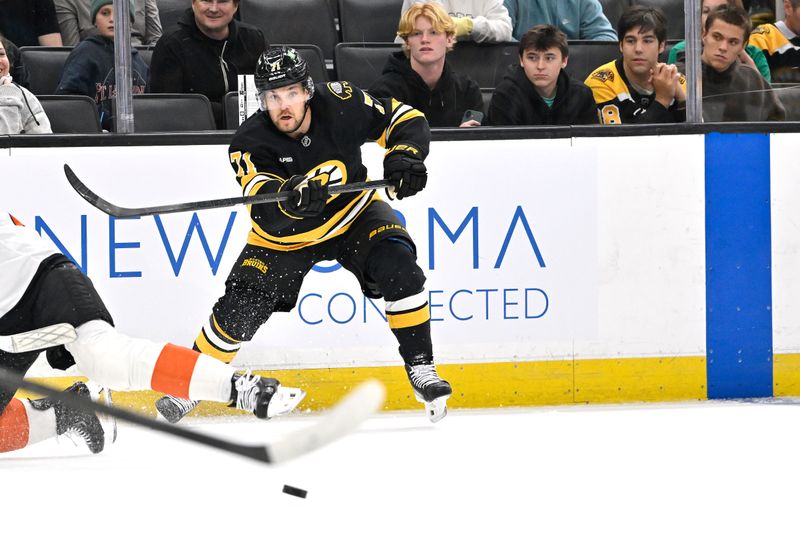 Sep 29, 2025; Boston, Massachusetts, USA;  Boston Bruins left wing Viktor Arvidsson (71) passes the puck against the Philadelphia Flyers during the first period at TD Garden. Mandatory Credit: Eric Canha-Imagn Images