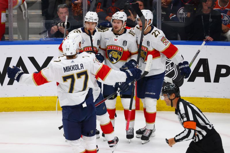 Jun 15, 2024; Edmonton, Alberta, CAN; Florida Panthers right wing Vladimir Tarasenko (10) celebrates a gaol with Florida Panthers center Anton Lundell (15) and center Eetu Luostarinen (27) in the first period against the Edmonton Oilers in game four of the 2024 Stanley Cup Final at Rogers Place. Mandatory Credit: Sergei Belski-USA TODAY Sports