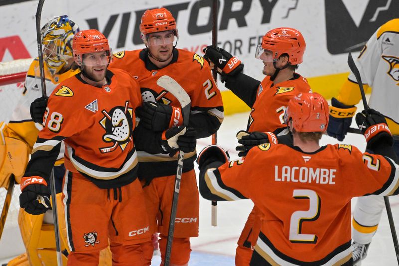 Jan 25, 2025; Anaheim, California, USA; Anaheim Ducks center Jansen Harkins (38),  is congratulated by right wing Brett Leason (20), center Isac Lundestrom (21) and defenseman Jackson LaCombe (2) after scoring a goal in the second period against the Nashville Predators at Honda Center. Mandatory Credit: Jayne Kamin-Oncea-Imagn Images