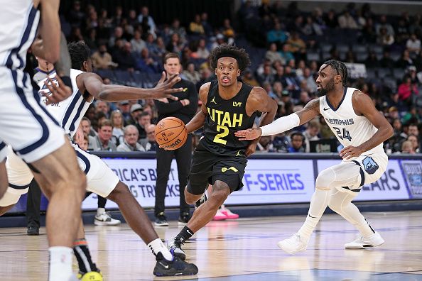 MEMPHIS, TENNESSEE - NOVEMBER 29: Collin Sexton #2 of the Utah Jazz drives to the basket against Jaylen Nowell #24 of the Memphis Grizzlies during the second half at FedExForum on November 29, 2023 in Memphis, Tennessee. NOTE TO USER: User expressly acknowledges and agrees that, by downloading and or using this photograph, User is consenting to the terms and conditions of the Getty Images License Agreement.  (Photo by Justin Ford/Getty Images)