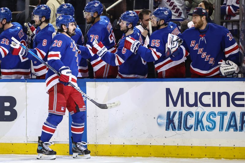 Apr 7, 2024; New York, New York, USA;  New York Rangers left wing Chris Kreider (20) celebrates with his teammates after scoring a goal in the third period against the Montreal Canadiens at Madison Square Garden. Mandatory Credit: Wendell Cruz-USA TODAY Sports