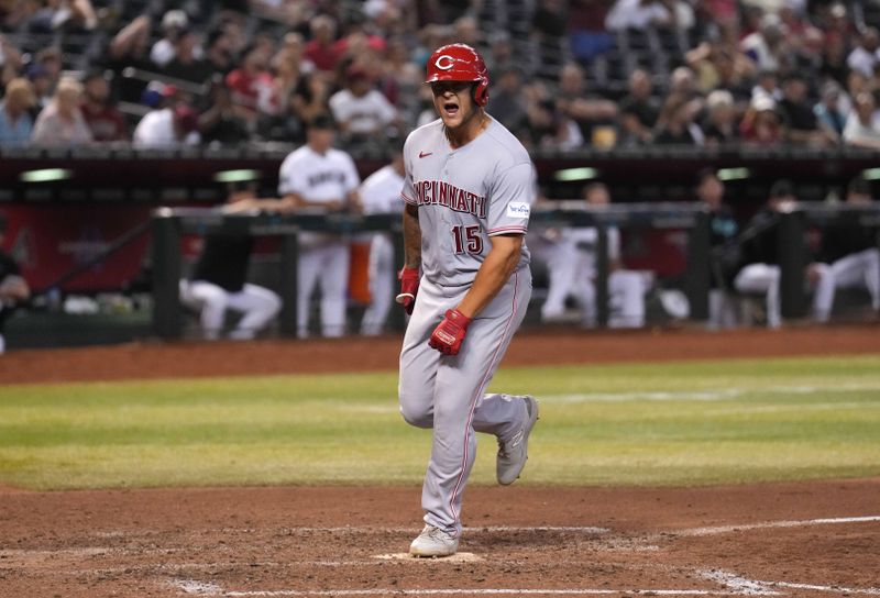 Aug 24, 2023; Phoenix, Arizona, USA; Cincinnati Reds pinch hitter Nick Senzel (15) reacts after hitting a solo home run against the Arizona Diamondbacks during the eighth inning at Chase Field. Mandatory Credit: Joe Camporeale-USA TODAY Sports