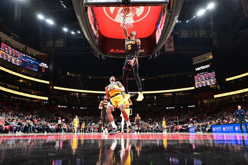 ATLANTA, GA - JANUARY 12: Dejounte Murray #5 of the Atlanta Hawks dunks the ball during the game against the Indiana Pacers on January 12, 2024 at State Farm Arena in Atlanta, Georgia.  NOTE TO USER: User expressly acknowledges and agrees that, by downloading and/or using this Photograph, user is consenting to the terms and conditions of the Getty Images License Agreement. Mandatory Copyright Notice: Copyright 2024 NBAE (Photo by Adam Hagy/NBAE via Getty Images)