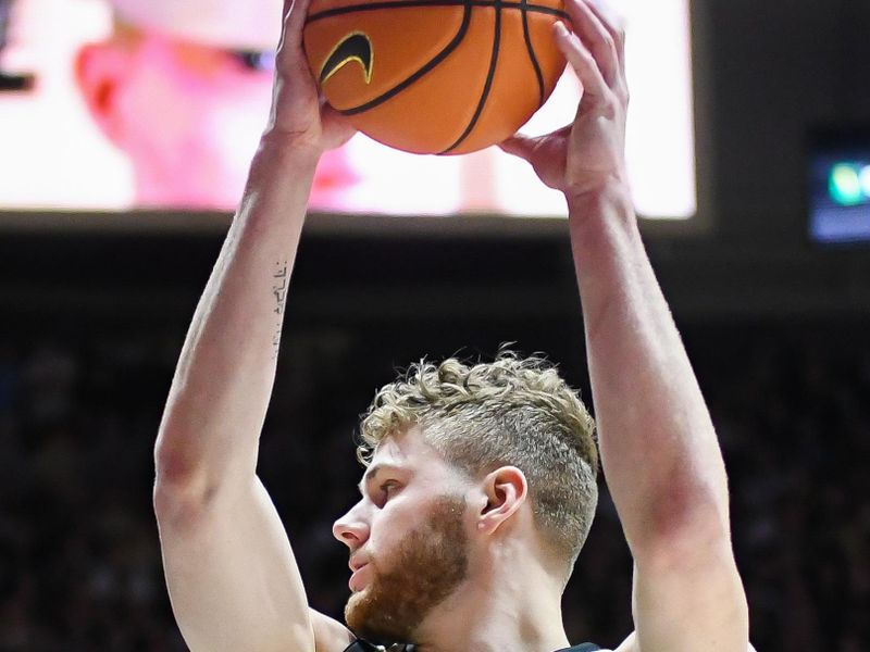 Feb 15, 2024; West Lafayette, Indiana, USA; Purdue Boilermakers forward Caleb Furst (1) rebounds the ball against the Minnesota Golden Gophers during the first half at Mackey Arena. Mandatory Credit: Robert Goddin-USA TODAY Sports