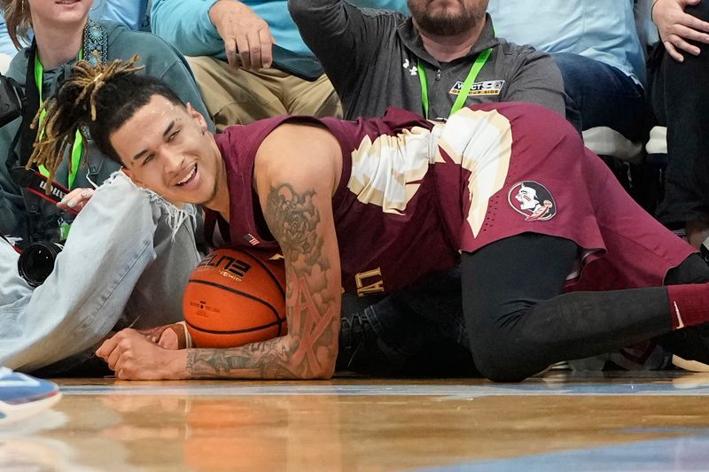 Dec 2, 2023; Chapel Hill, North Carolina, USA;  Florida State Seminoles forward De'Ante Green (5) reacts in the first half at Dean E. Smith Center. Mandatory Credit: Bob Donnan-USA TODAY Sports