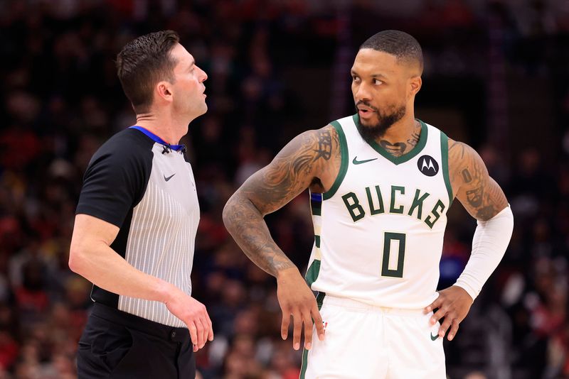 CHICAGO, ILLINOIS - NOVEMBER 30: Damian Lillard #0 of the Milwaukee Bucks speaks with referee Ben Taylor #46 during the first half in the game against the Chicago Bulls at the United Center on November 30, 2023 in Chicago, Illinois. NOTE TO USER: User expressly acknowledges and agrees that, by downloading and or using this photograph, User is consenting to the terms and conditions of the Getty Images License Agreement. (Photo by Justin Casterline/Getty Images)