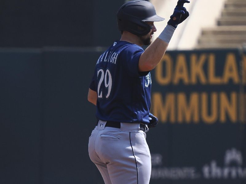 Sep 20, 2023; Oakland, California, USA; Seattle Mariners catcher Cal Raleigh (29) gestures after hitting a double against the Oakland Athletics during the first inning at Oakland-Alameda County Coliseum. Mandatory Credit: Kelley L Cox-USA TODAY Sports