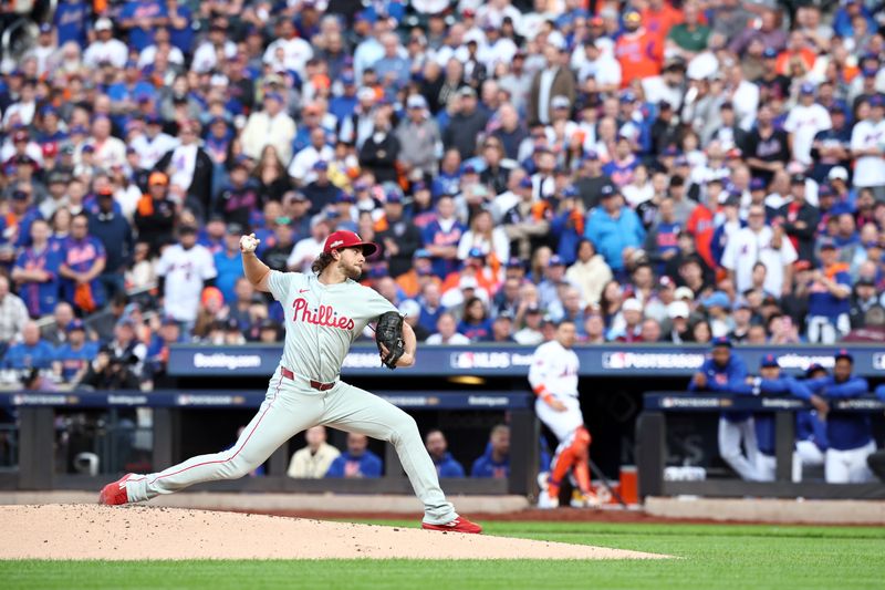 iOct 8, 2024; New York City, New York, USA; Philadelphia Phillies pitcher Aaron Nola (27) pitches against the New York Mets in the first inning during game three of the NLDS for the 2024 MLB Playoffs at Citi Field. Mandatory Credit: Vincent Carchietta-Imagn Images