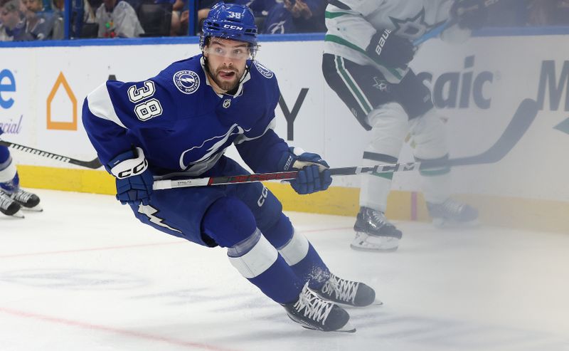 Dec 4, 2023; Tampa, Florida, USA; Tampa Bay Lightning left wing Brandon Hagel (38) skates against the Dallas Stars during the first period at Amalie Arena. Mandatory Credit: Kim Klement Neitzel-USA TODAY Sports