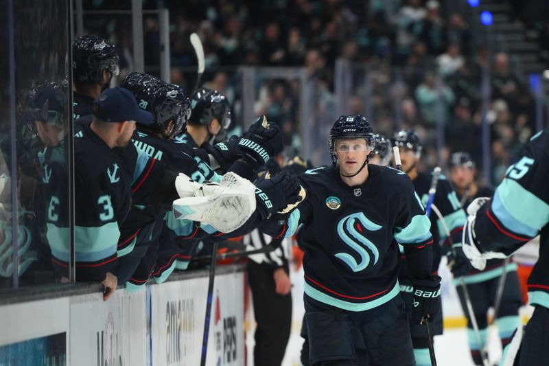 Oct 9, 2025; Seattle, Washington, USA; Seattle Kraken left wing Jared McCann (19) celebrates with the bench after scoring a goal against the Anaheim Ducks during the third period at Climate Pledge Arena. Mandatory Credit: Steven Bisig-Imagn Images