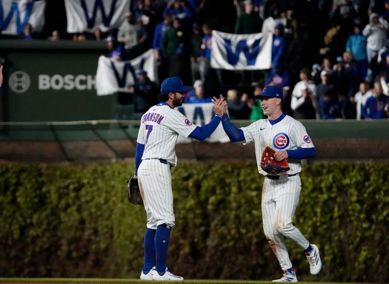May 5, 2025; Chicago, Illinois, USA; Chicago Cubs shortstop Dansby Swanson (7) and outfielder Pete Crow-Armstrong (4) celebrate a win against the San Francisco Giants at Wrigley Field. Mandatory Credit: David Banks-Imagn Images