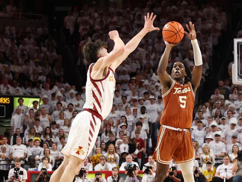 Jan 17, 2023; Ames, Iowa, USA; Iowa State Cyclones guard Caleb Grill (2) defends the shot from Texas Longhorns guard Marcus Carr (5) during the second half at James H. Hilton Coliseum. Mandatory Credit: Reese Strickland-USA TODAY Sports