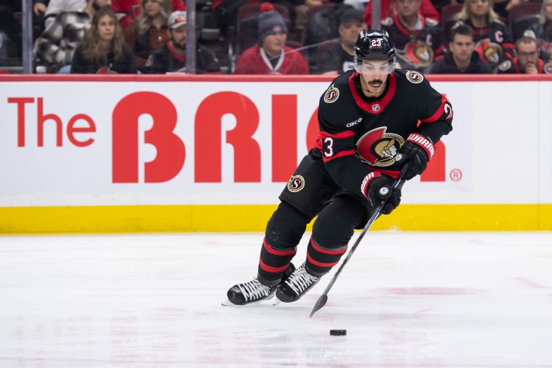 Oct 5, 2024; Ottawa, Ontario, CAN; Ottawa Senators defenseman Travis Hamonic (23) skates with the puck in the second period against the Montreal Canadiens at the Canadian Tire Centre. Mandatory Credit: Marc DesRosiers-Imagn Images