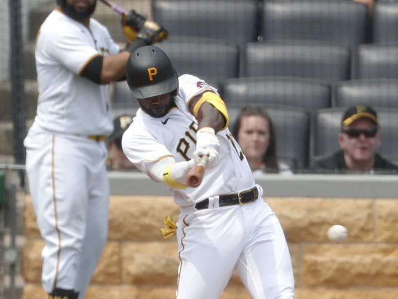 May 10, 2023; Pittsburgh, Pennsylvania, USA;  Pittsburgh Pirates designated hitter Andrew McCutchen (22) hits a single against the Colorado Rockies during the sixth inning at PNC Park. Mandatory Credit: Charles LeClaire-USA TODAY Sports