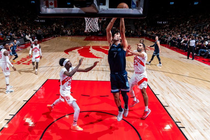 TORONTO, CANADA - JANUARY 22: Santi Aldama #7 of the Memphis Grizzlies drives to the basket during the game against the Toronto Raptors on January 22, 2024 at the Scotiabank Arena in Toronto, Ontario, Canada.  NOTE TO USER: User expressly acknowledges and agrees that, by downloading and or using this Photograph, user is consenting to the terms and conditions of the Getty Images License Agreement.  Mandatory Copyright Notice: Copyright 2024 NBAE (Photo by Mark Blinch/NBAE via Getty Images)