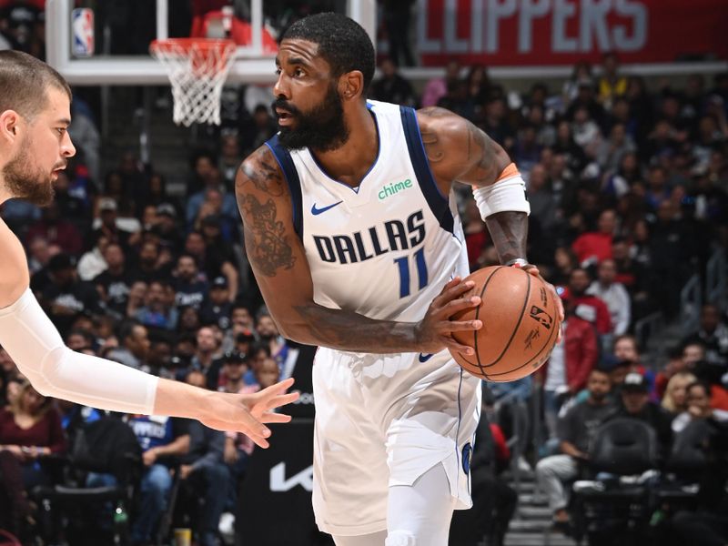 LOS ANGELES, CA - APRIL 23: Kyrie Irving #11 of the Dallas Mavericks handles the ball during the game against the LA Clippers during Round 1 Game 2 of the 2024 NBA Playoffs on April 23, 2024 at Crypto.Com Arena in Los Angeles, California. NOTE TO USER: User expressly acknowledges and agrees that, by downloading and/or using this Photograph, user is consenting to the terms and conditions of the Getty Images License Agreement. Mandatory Copyright Notice: Copyright 2024 NBAE (Photo by Andrew D. Bernstein/NBAE via Getty Images)