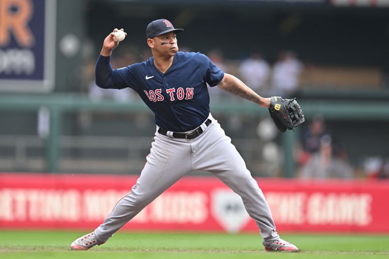 Jun 22, 2023; Minneapolis, Minnesota, USA; Boston Red Sox third baseman Rafael Devers (11) makes a putout during the first inning against the Minnesota Twins at Target Field. Mandatory Credit: Jeffrey Becker-USA TODAY Sports