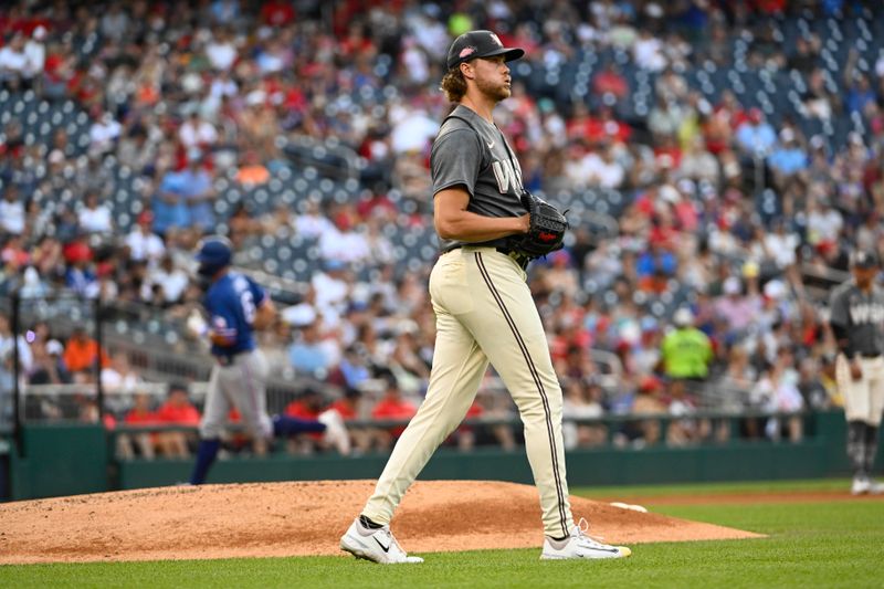 Jul 8, 2023; Washington, District of Columbia, USA; Washington Nationals starting pitcher Jake Irvin (74) reacts after giving up a two run home run to Texas Rangers third baseman Josh Jung (6) at Nationals Park. Mandatory Credit: Brad Mills-USA TODAY Sports