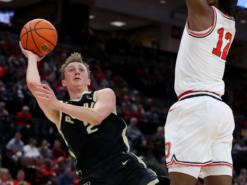 Feb 18, 2024; Columbus, Ohio, USA;  Purdue Boilermakers guard Fletcher Loyer (2) takes the shot as Ohio State Buckeyes guard Evan Mahaffey (12) defends during the first half at Value City Arena. Mandatory Credit: Joseph Maiorana-USA TODAY Sports