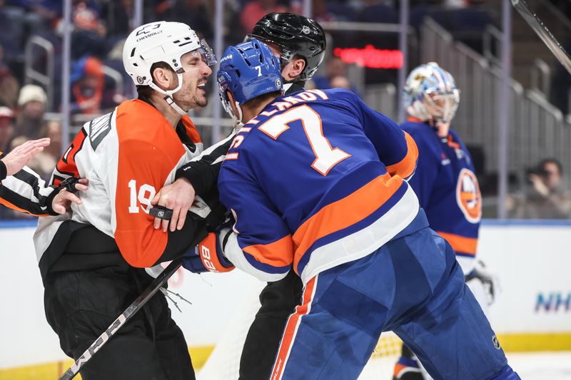 Jan 16, 2025; Elmont, New York, USA;  An official attempts to separate Philadelphia Flyers right wing Garnet Hathaway (19) and New York Islanders right wing Maxim Tsyplakov (7) in the first period at UBS Arena. Mandatory Credit: Wendell Cruz-Imagn Images