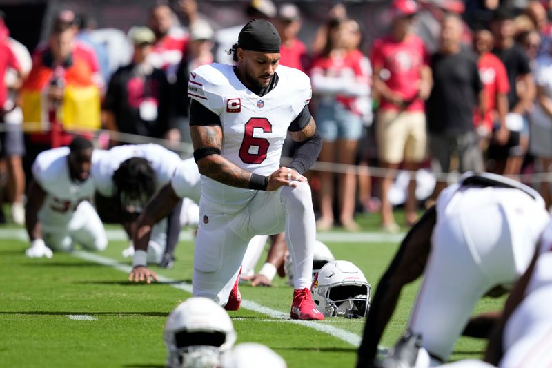 Arizona Cardinals running back James Conner warms up before an NFL football game against the San Francisco 49ers in Santa Clara, Calif., Sunday, Oct. 6, 2024. (AP Photo/Godofredo A. Vásquez)