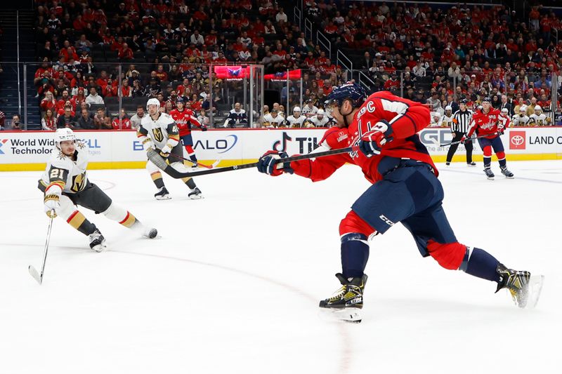 Oct 15, 2024; Washington, District of Columbia, USA; Washington Capitals left wing Alex Ovechkin (8) shoots the puck as Vegas Golden Knights center Brett Howden (21) defends in the first period at Capital One Arena. Mandatory Credit: Geoff Burke-Imagn Images