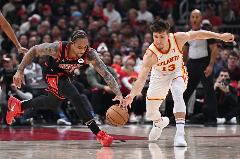 CHICAGO, ILLINOIS - APRIL 17:  DeMar DeRozan #11 of the Chicago Bulls and Bogdan Bogdanovic #13 of the Atlanta Hawks battle for control of the ball in the first half during the play-in tournament on April 17, 2024 at United Center in Chicago, Illinois. NOTE TO USER: User expressly acknowledges and agrees that, by downloading and or using this photograph, User is consenting to the terms and conditions of the Getty Images License Agreement.  (Photo by Jamie Sabau/Getty Images)