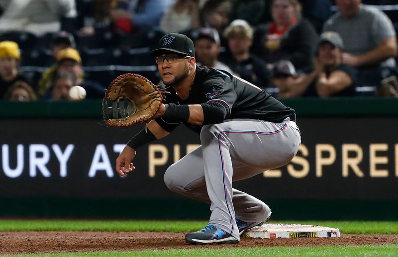 Sep 29, 2023; Pittsburgh, Pennsylvania, USA;  Miami Marlins first baseman Yuli Gurriel (10) takes a throw to retire Pittsburgh Pirates first baseman Connor Joe (not pictured) for the first out of he ninth inning at PNC Park. Miami won 4-3. Mandatory Credit: Charles LeClaire-USA TODAY Sports