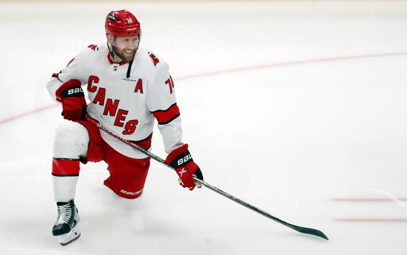 Mar 26, 2024; Pittsburgh, Pennsylvania, USA; Carolina Hurricanes defenseman Jaccob Slavin (74) warms up against the Pittsburgh Penguins at PPG Paints Arena. Mandatory Credit: Charles LeClaire-USA TODAY Sports