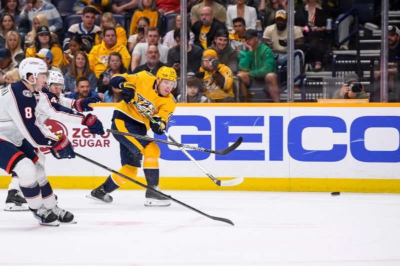 Apr 13, 2024; Nashville, Tennessee, USA; Nashville Predators center Jaret Anderson-Dolan (28) takes a shot on goal against the Columbus Blue Jackets during the third period at Bridgestone Arena. Mandatory Credit: Steve Roberts-USA TODAY Sports