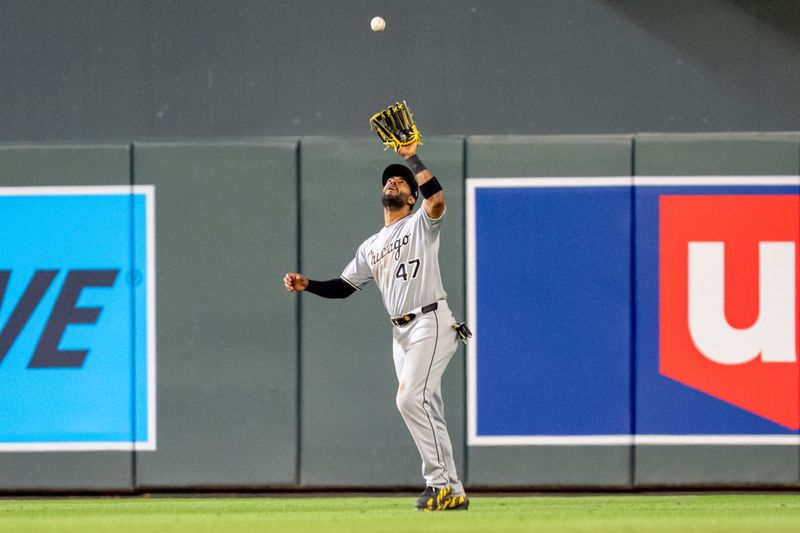 Apr 23, 2025; Minneapolis, Minnesota, USA; Chicago White Sox right fielder Joshua Palacios (47) catches a ball hit by Minnesota Twins catcher Ryan Jeffers (27) for the third out in the eighth inning at Target Field. Mandatory Credit: Matt Blewett-Imagn Images