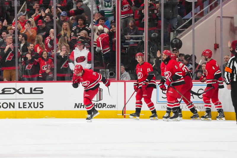 Dec 9, 2025; Raleigh, North Carolina, USA;  Carolina Hurricanes center Seth Jarvis (24) celebrates his goal against the Columbus Blue Jackets during the second period at Lenovo Center. Mandatory Credit: James Guillory-Imagn Images