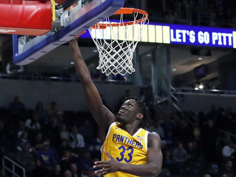 Jan 3, 2023; Pittsburgh, Pennsylvania, USA; Pittsburgh Panthers center Federiko Federiko (33) shoots the ball against the Virginia Cavaliers during the second half at the Petersen Events Center. Pittsburgh won 68-65. Mandatory Credit: Charles LeClaire-USA TODAY Sports