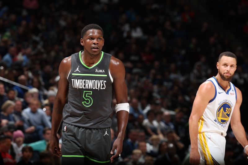 MINNEAPOLIS, MN -  MARCH 24: Anthony Edwards #5 of the Minnesota Timberwolves looks on during the game against the Golden State Warriors on March 24, 2024 at Target Center in Minneapolis, Minnesota. NOTE TO USER: User expressly acknowledges and agrees that, by downloading and or using this Photograph, user is consenting to the terms and conditions of the Getty Images License Agreement. Mandatory Copyright Notice: Copyright 2024 NBAE (Photo by David Sherman/NBAE via Getty Images)