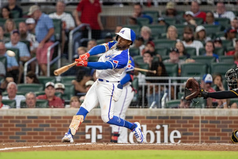 Sep 9, 2023; Cumberland, Georgia, USA; Atlanta Braves second baseman Ozzie Albies (1) hits single against Pittsburgh Pirates during third inning at Truist Park. Mandatory Credit: Jordan Godfree-USA TODAY Sports