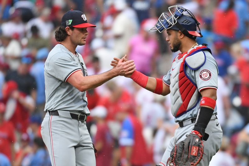 Aug 18, 2024; Philadelphia, Pennsylvania, USA;  Washington Nationals pitcher Kyle Finnegan (67) and catcher Keibert Ruiz (20) celebrate win against the Philadelphia Phillies at Citizens Bank Park. Mandatory Credit: Eric Hartline-USA TODAY Sports