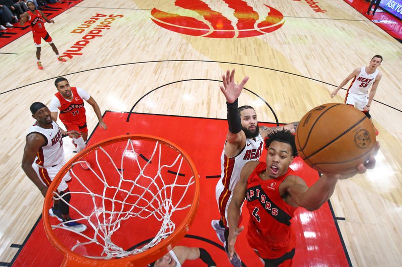 TORONTO, CANADA - JANUARY 17: Scottie Barnes #4 of the Toronto Raptors drives to the basket during the game against the Miami Heat on January 17, 2024 at the Scotiabank Arena in Toronto, Ontario, Canada.  NOTE TO USER: User expressly acknowledges and agrees that, by downloading and or using this Photograph, user is consenting to the terms and conditions of the Getty Images License Agreement.  Mandatory Copyright Notice: Copyright 2024 NBAE (Photo by Vaughn Ridley/NBAE via Getty Images)