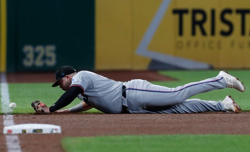 Sep 10, 2024; Pittsburgh, Pennsylvania, USA;  A ball hit by Pittsburgh Pirates catcher Joey Bart (not pictured) eludes Miami Marlins third baseman Jake Burger (36) for a double during the fourth inning at PNC Park. Mandatory Credit: Charles LeClaire-Imagn Images