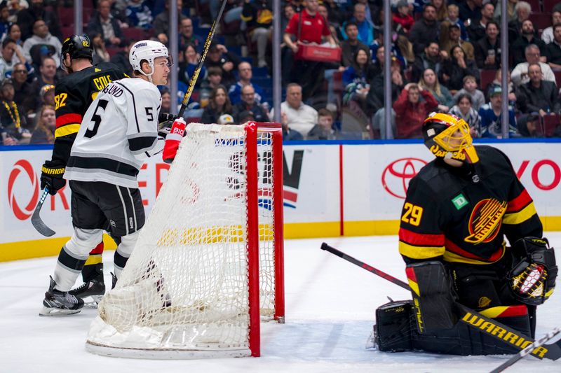 Mar 25, 2024; Vancouver, British Columbia, CAN;  Los Angeles Kings defenseman Andreas Englund (5) celebrate a goal scored on Vancouver Canucks goalie Casey DeSmith (29) by forward Blake Lizotte (not pictured) in the second period  at Rogers Arena. Mandatory Credit: Bob Frid-USA TODAY Sports