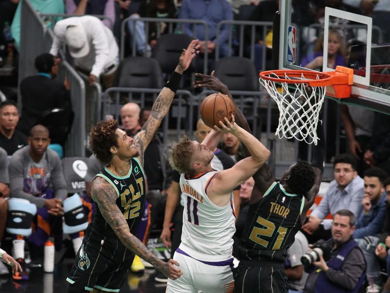 CHARLOTTE, NC - MARCH 1: Lock Landale #11 of the Phoenix Suns drives to the basket during the game against the Charlotte Hornets on March 1, 2023 at Spectrum Center in Charlotte, North Carolina. NOTE TO USER: User expressly acknowledges and agrees that, by downloading and or using this photograph, User is consenting to the terms and conditions of the Getty Images License Agreement.  Mandatory Copyright Notice:  Copyright 2023 NBAE (Photo by Brock Williams-Smith/NBAE via Getty Images)