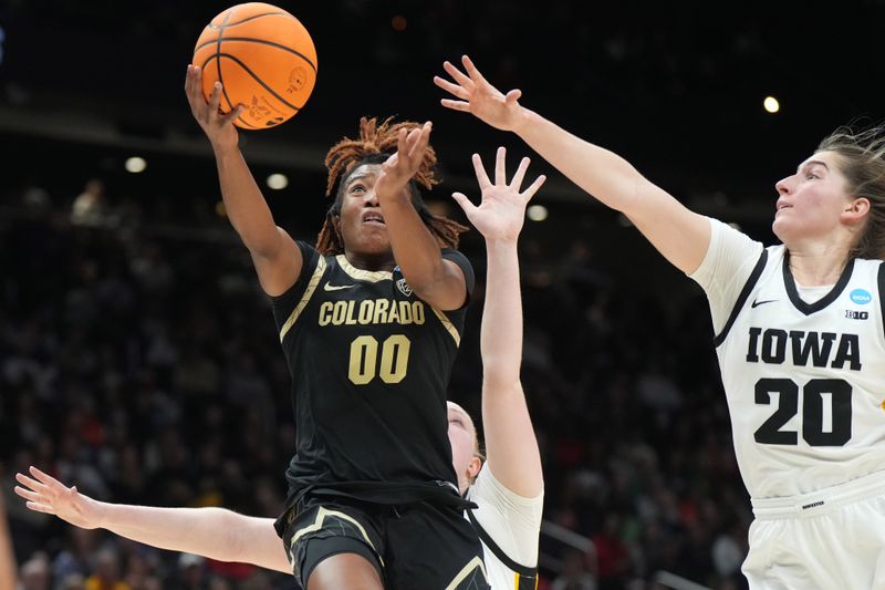 Mar 24, 2023; Seattle, WA, USA; Colorado Buffaloes guard Jaylyn Sherrod (00) shoots the ball against Iowa Hawkeyes guard Kate Martin (20) and forward Addison O'Grady (44) in the second half at Climate Pledge Arena. Mandatory Credit: Kirby Lee-USA TODAY Sports