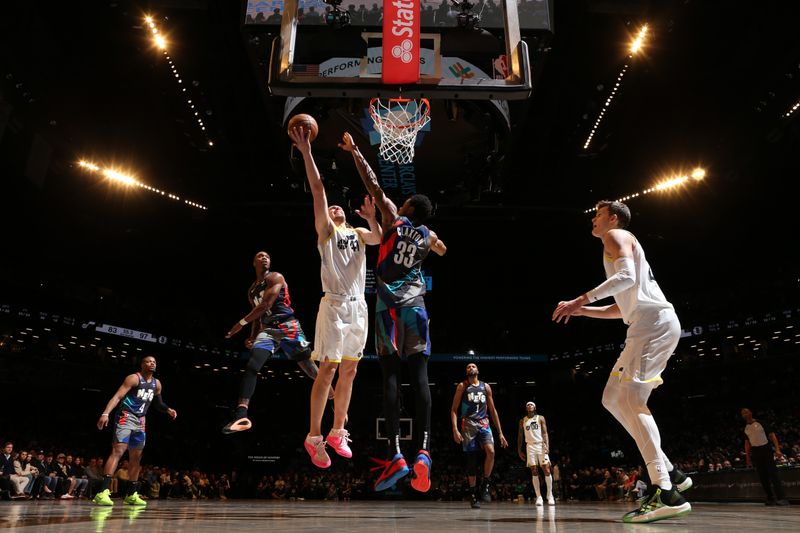 BROOKLYN, NY - JANUARY 29: Kelly Olynyk #41 of the Utah Jazz drives to the basket during the game against the Brooklyn Nets on January 29, 2024 at Barclays Center in Brooklyn, New York. NOTE TO USER: User expressly acknowledges and agrees that, by downloading and or using this Photograph, user is consenting to the terms and conditions of the Getty Images License Agreement. Mandatory Copyright Notice: Copyright 2024 NBAE (Photo by Nathaniel S. Butler/NBAE via Getty Images)