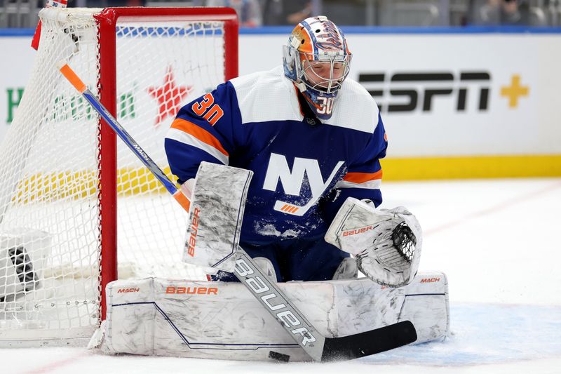 Dec 19, 2023; Elmont, New York, USA; New York Islanders goaltender Ilya Sorokin (30) makes a save against the Edmonton Oilers during the first period at UBS Arena. Mandatory Credit: Brad Penner-USA TODAY Sports