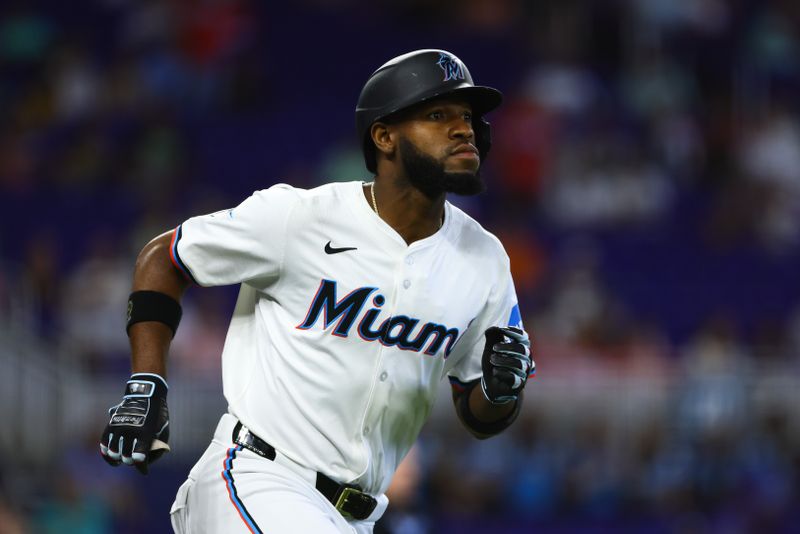 Apr 17, 2024; Miami, Florida, USA; Miami Marlins designated hitter Bryan De La Cruz (14) circles the bases after hitting a home run against the San Francisco Giants during the sixth inning at loanDepot Park. Mandatory Credit: Sam Navarro-USA TODAY Sports