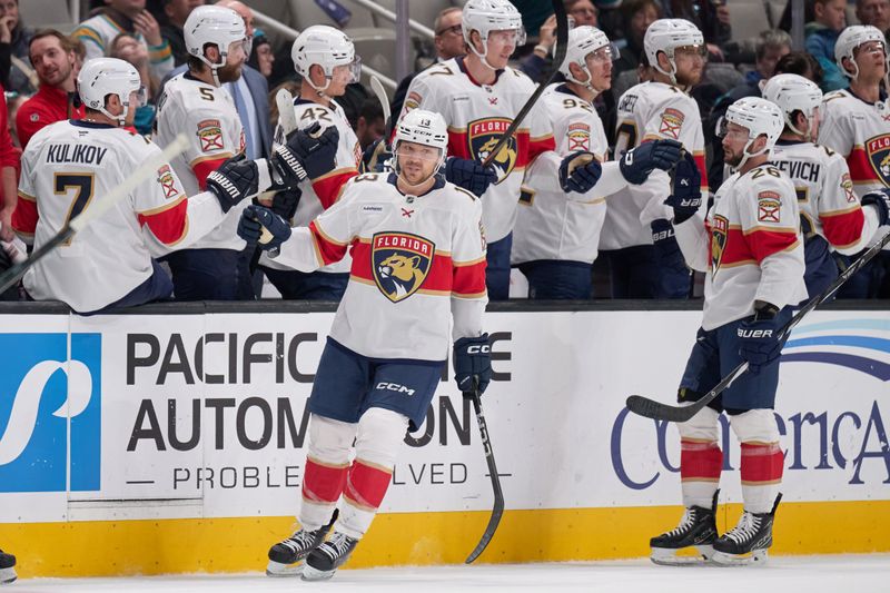 Jan 25, 2025; San Jose, California, USA; Florida Panthers center Sam Reinhart (13) shakes hands with his teammates on the bench after scoring a goal against the San Jose Sharks during the second period at SAP Center at San Jose. Mandatory Credit: Robert Edwards-Imagn Images