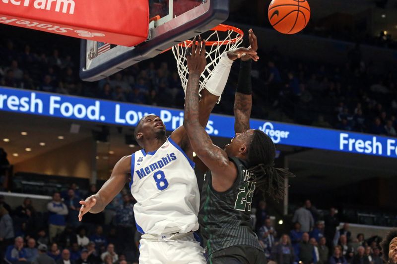 Feb 11, 2024; Memphis, Tennessee, USA; Memphis Tigers forward David Jones (8) blocks the shot of Tulane Green Wave forward Kevin Cross (24) during the second half at FedExForum. Mandatory Credit: Petre Thomas-USA TODAY Sports