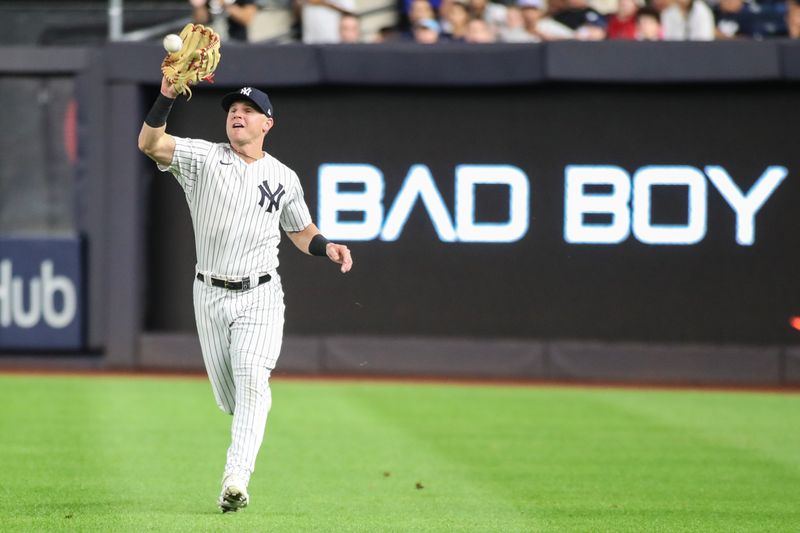 Sep 8, 2023; Bronx, New York, USA;  New York Yankees right fielder Jake Bauers (61) makes a running catch in the fifth inning against the Milwaukee Brewers at Yankee Stadium. Mandatory Credit: Wendell Cruz-USA TODAY Sports